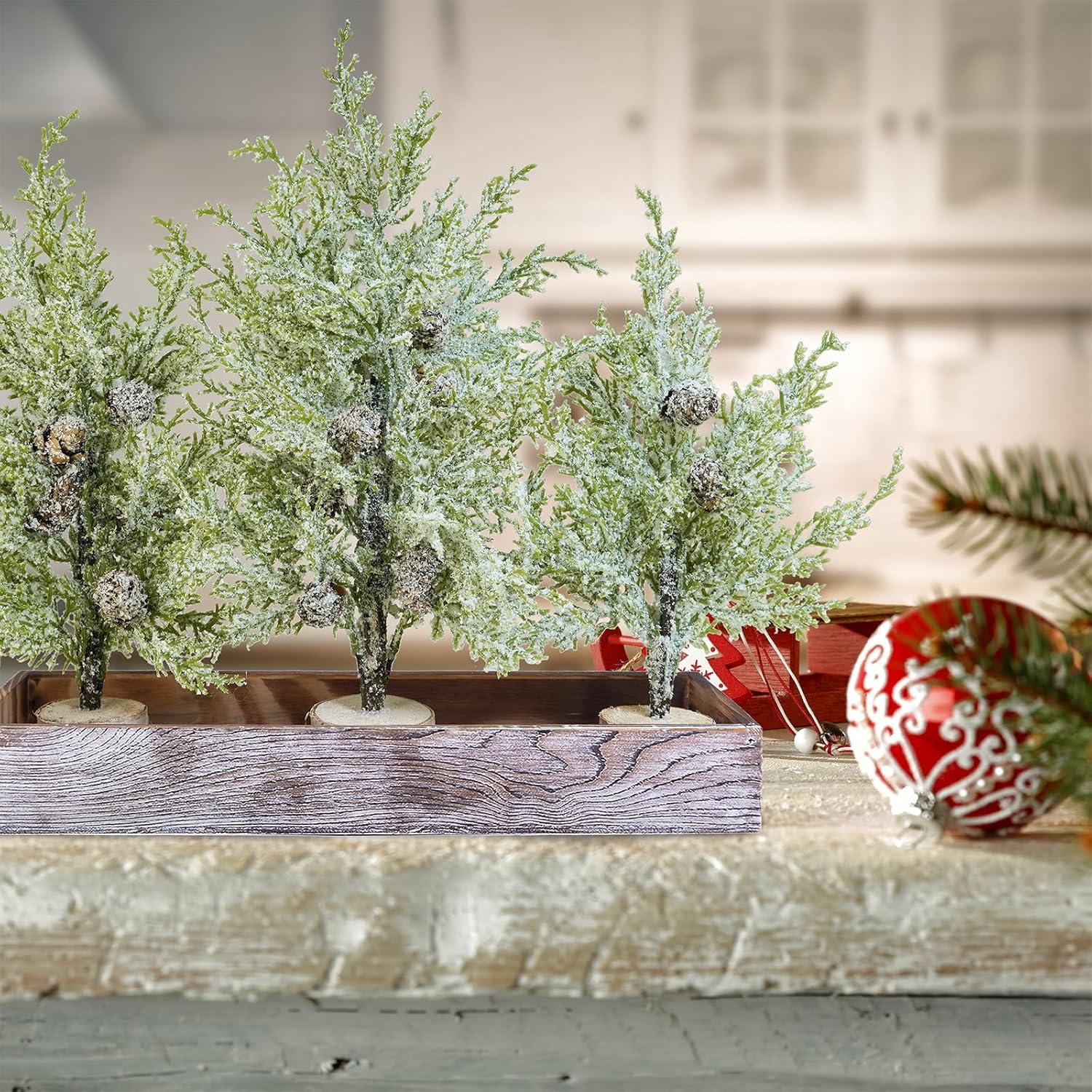 imageWinlyn 3 Pack Snowy Mini Cedar Trees with Pinecones and Wood Bases Artificial Small Christmas Tabletop Trees and Rustic Wood Planter for Winter Holiday Christmas Mantel Farmhouse Table Centerpiece