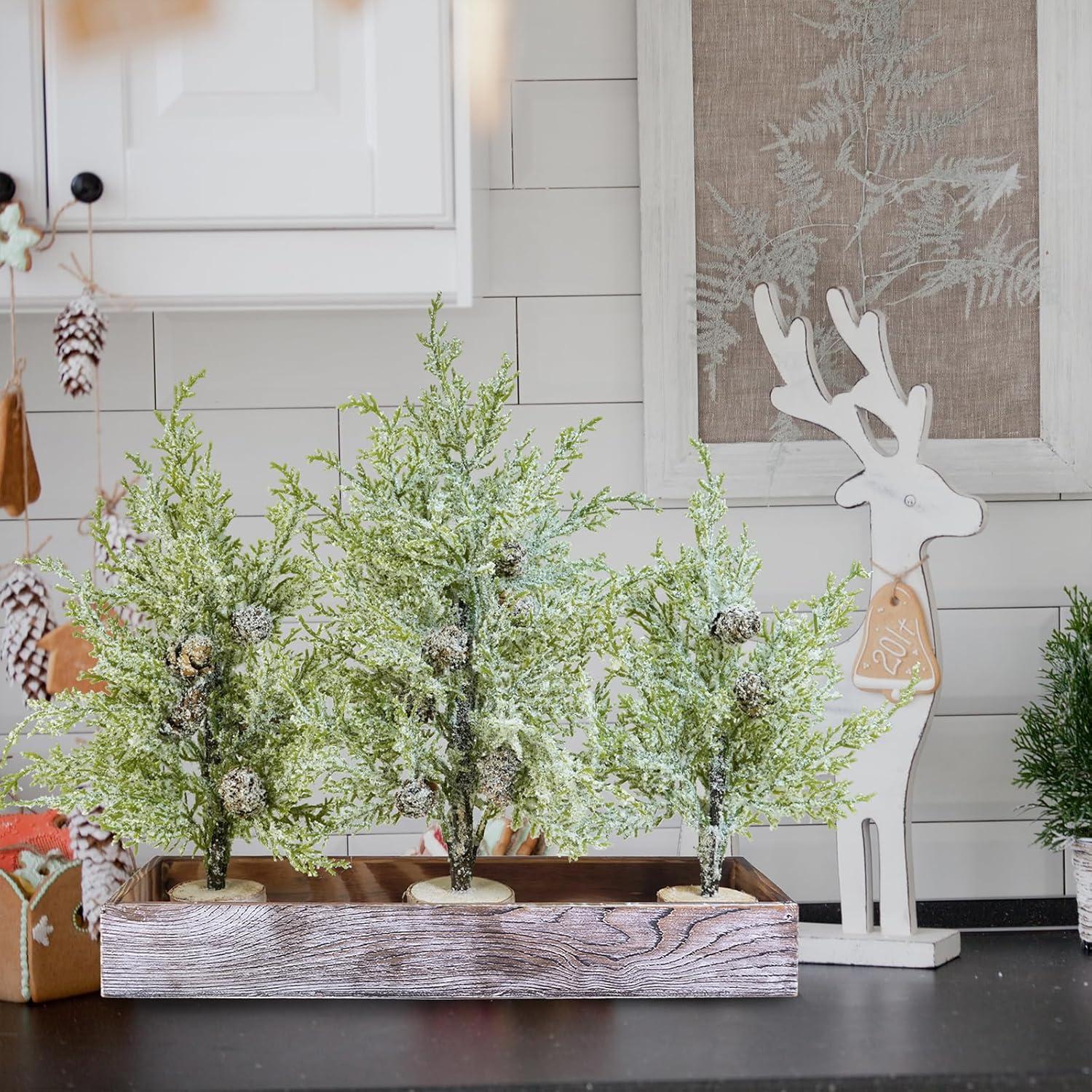 imageWinlyn 3 Pack Snowy Mini Cedar Trees with Pinecones and Wood Bases Artificial Small Christmas Tabletop Trees and Rustic Wood Planter for Winter Holiday Christmas Mantel Farmhouse Table Centerpiece
